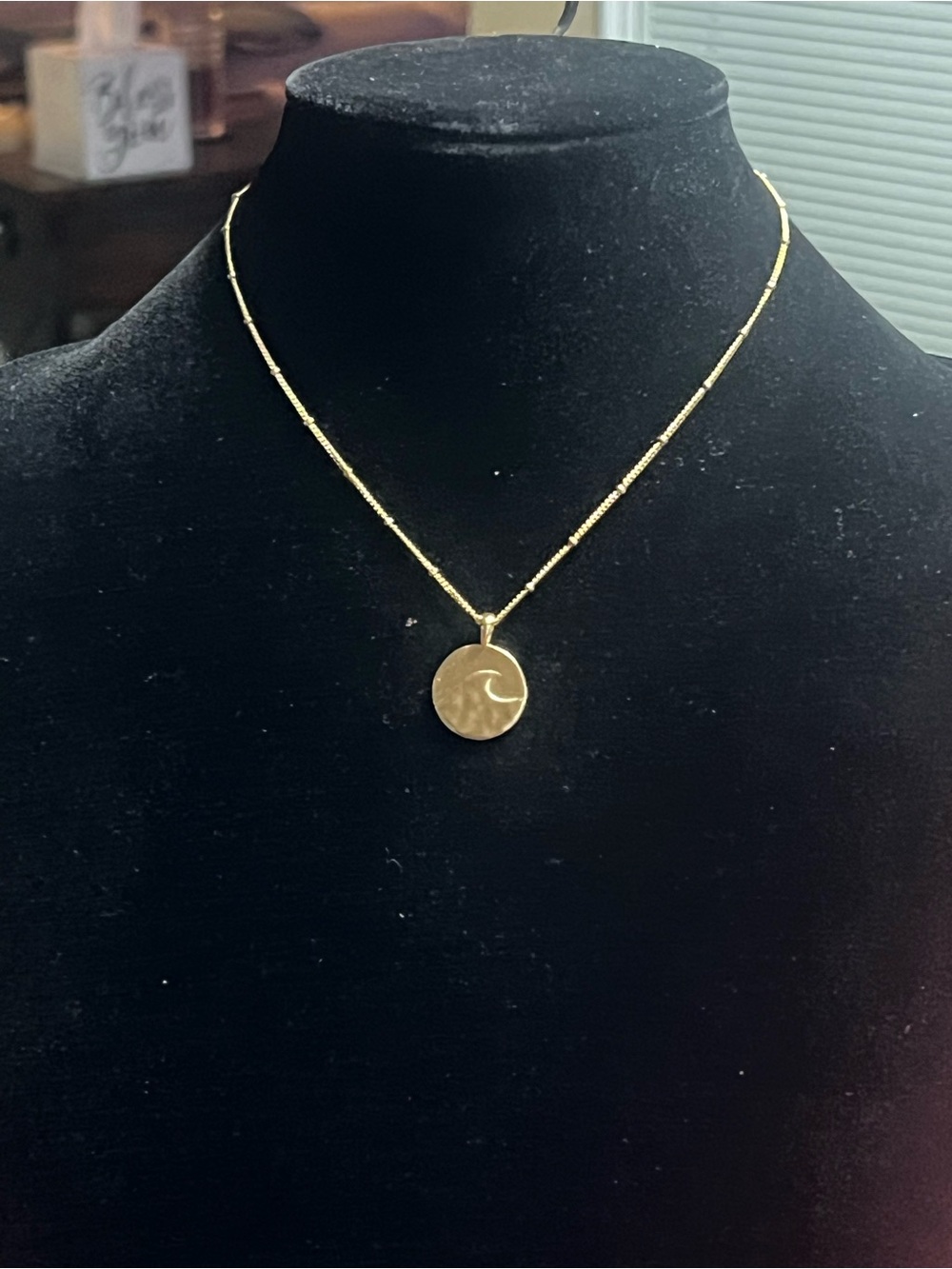 Delicate Gold Disc Necklace with Wave Motif